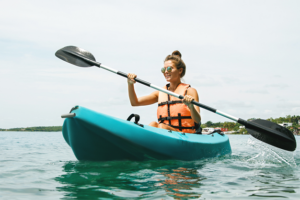 woman kayaking in mental health recovery treatment