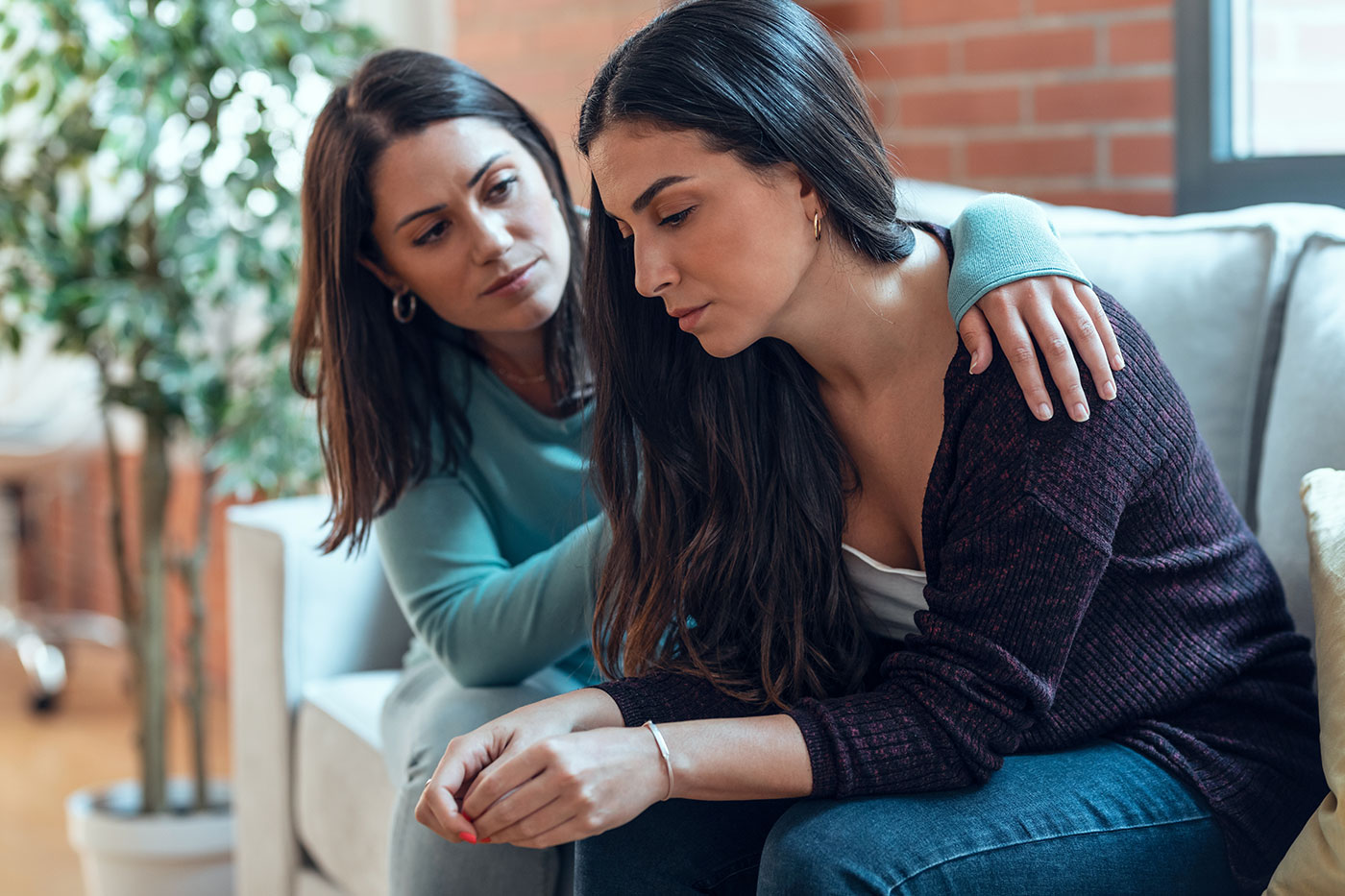 woman consoling another woman